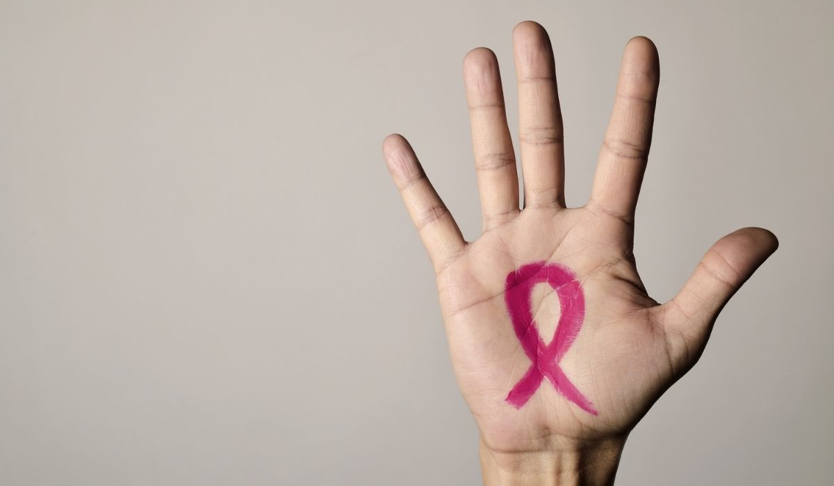 Breast Cancer in Men - Pink Breast Cancer Ribbon on Man's Hand
