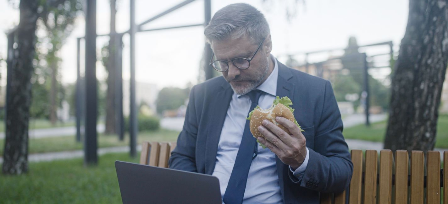 Prostate Cancer Risk Factors man eating burger on lunch